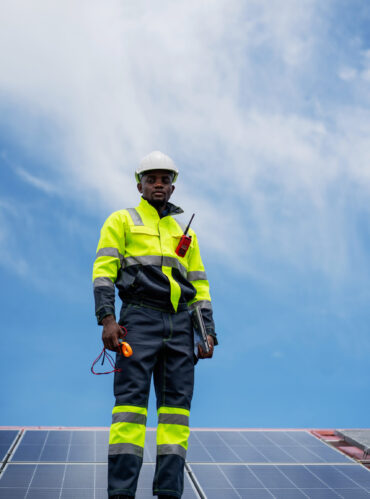 Service engineer checking solar cell on the roof for maintenance if there is a damaged part. Engineer worker install solar panel. Clean energy concept.